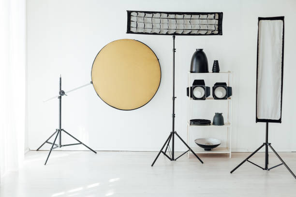 istock Photo studio accessories photographer flash white room 1217539784