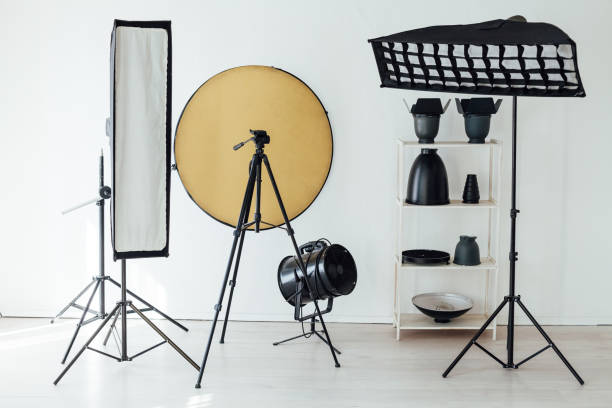 istock Photo studio accessories photographer flash white room 1217540083