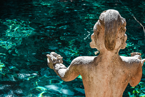 Statue in Zacil-Ha Cenote, Quintana Roo, Mexico - 12 February, 2019: \nMayan statue that protects the crystal clear waters of the Zacil-Ha cenote. Zacil-Ha Cenote located in the state of Quintana Roo, 8 kilometers from the town of Tulum, on federal highway 109, destined for the Coba Archaeological Zone.