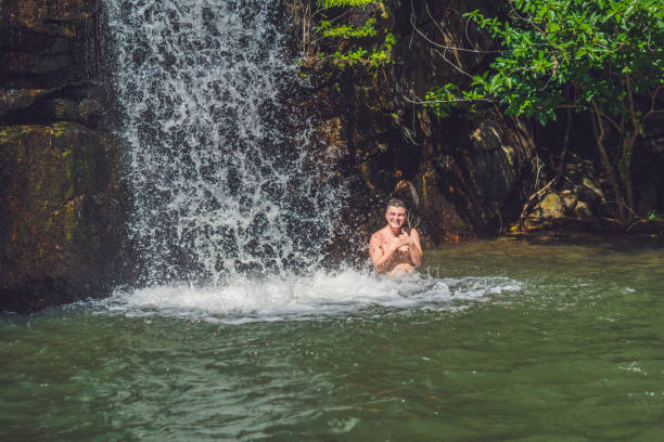istock Smooth rocks and pond on a tropical forest background 1217541732