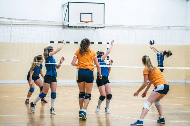 istock Female volleyball teams playing a match 1217541881