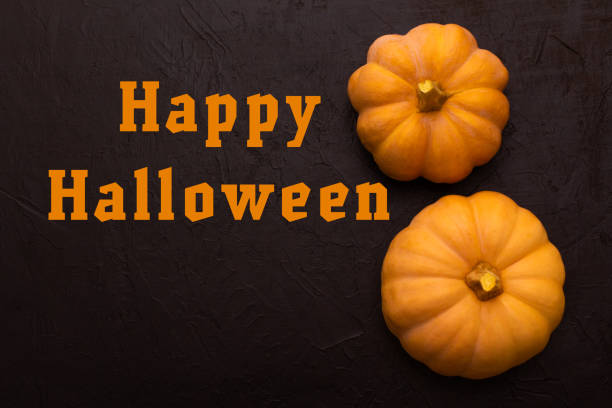 istock Pumpkins on black table. Halloween background 1217546580