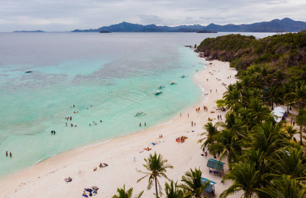 istock Aerial view beautiful beach on a tropical island Malcapuya. Philippines 1217547540