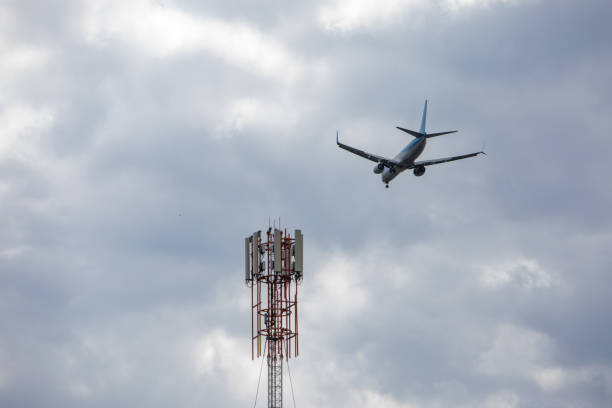 istock plane in sky landing overcast weather 1217552119