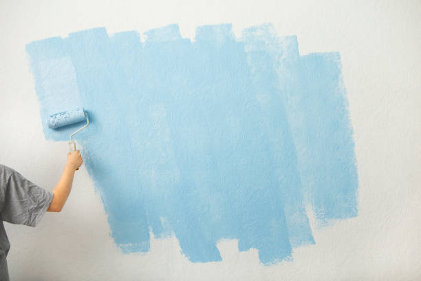 istock First layer of blue paint on the wall 1217553341