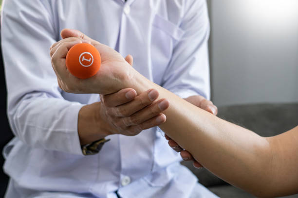 istock instructor assisting senior doing exercise working out in clinic strengthening muscles and developing joints 1217553515