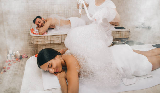 istock Hammam clients enjoying a foam massage in a Turkish bath. Procedures in oriental bath improves skin and stops aging process 1217556169