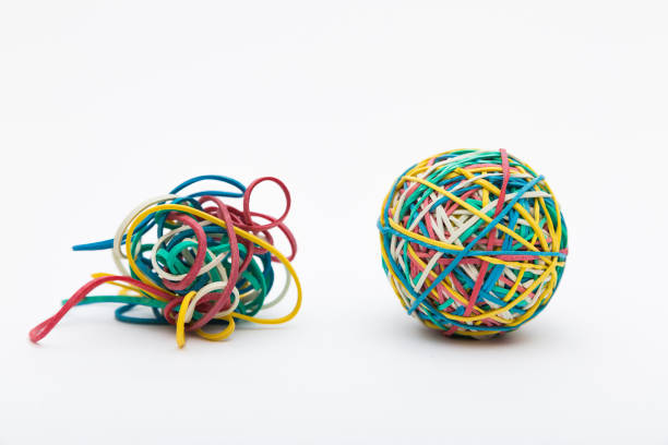 istock Pull yourself together! Coloured rubber band ball and mess 1217556615