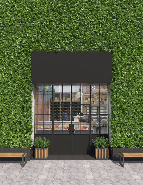 Vertical gardening facade of a store or cafe with glass entrance doors. Free space for signage. Facade is overgrown with curly ivy. Modern green architecture. Copy space. 3D rendering. Vertical gardening facade of a store or cafe with glass entrance doors. Free space for signage. Facade is overgrown with curly ivy. Modern green architecture. Copy space. 3D rendering store wall surrounding wall facade stock pictures, royalty-free photos & images