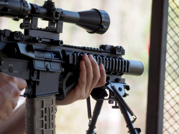 istock Man shooting on an outdoor shooting range, selective focus 1217557131