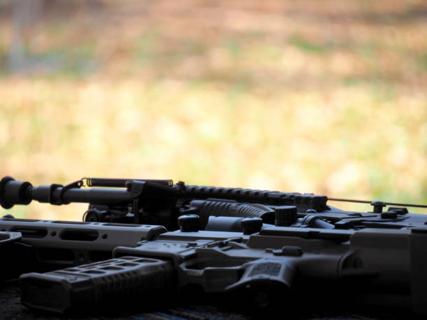 istock Man shooting on an outdoor shooting range, selective focus 1217557194