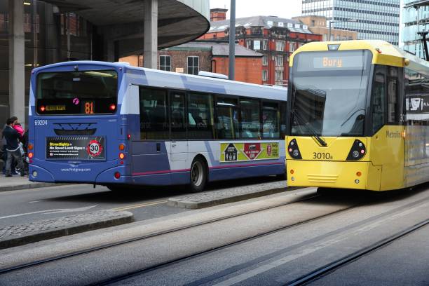 People ride Manchester tram in Manchester, UK. Manchester Metrolink serves 21 million rides annually (2011).