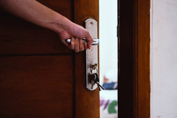 istock Hand holding door handle while stay at home 1217558187