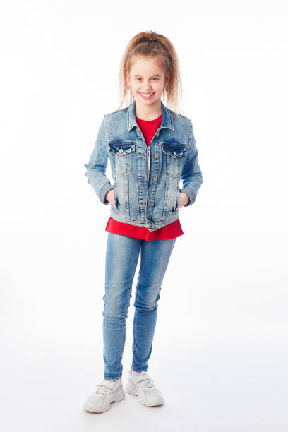 istock Young girl wearing denim posing in studio 1217558541