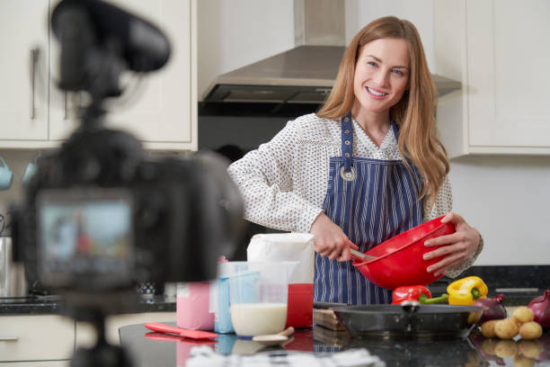 istock Female Vlogger Making Social Media Video About Cooking For The Internet 1217558549