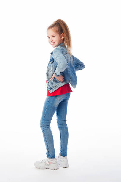 Young girl wearing denim looking backwards