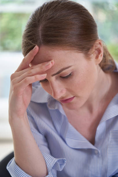 istock Sad Young Woman Suffering From Depression With Head In Hands 1217559576