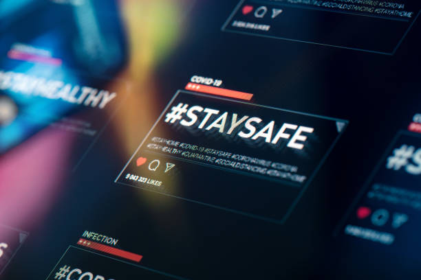 istock #staysafe. Stay safe hashtag close-up on digital display 1217559962