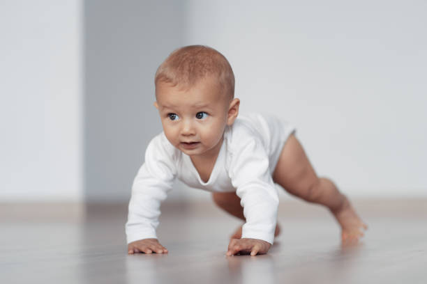 istock The kid is trying to take his first steps 1217561129