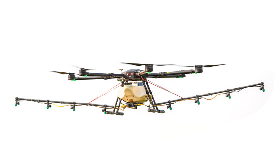Big agriculture drone flying over the rice field to sprayed chemical or fertilizer. Technology for agriculture concept