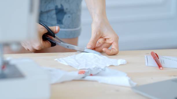 istock Concept during self-isolation and quarantine. Woman sews a mask 1217564374