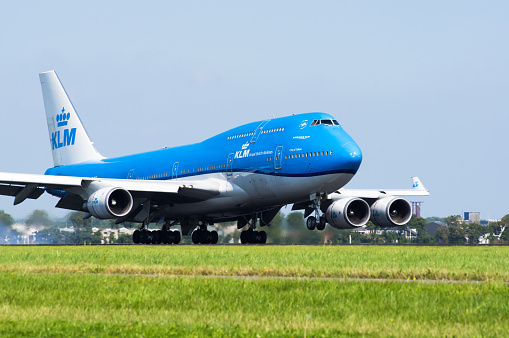 KLM Boeing 787 Dreamliner airplane landing at Schiphol airport on the Polderbaan. KLM stands for Koninklijke Luchtvaart Maatschappij,  Royal Dutch Airlines and is part of Air France–KLM. The Boeing 787 alos called Dreamliner is a wide-body jet airliner by American manufacturer Boeing Commercial Airplanes. Schiphol is one of the busiest and largest airports in Europe, located near Amsterdam, Netherlands. It serves as a major hub for international flights and is a key gateway to Europe.