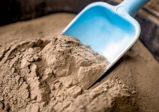 istock Dry cement and construction measuring shovel 1217564683
