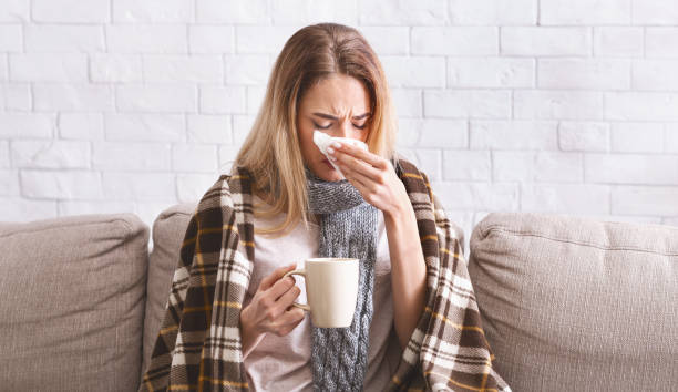 istock Girl with tea treated at home during coronavirus 1217565022