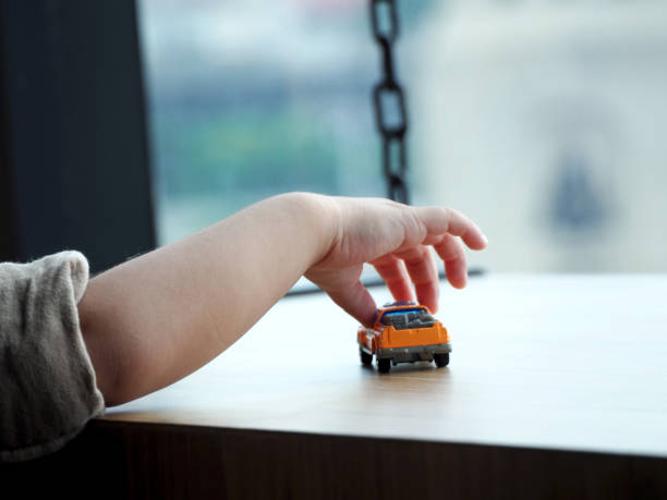istock Cute baby boy playing with toys 1217565368