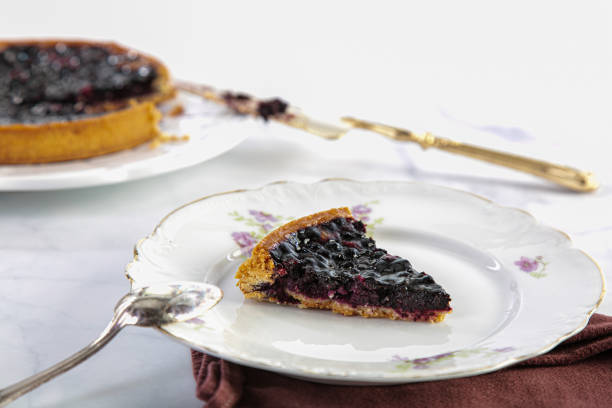 istock Cut blueberry tart with a cake slice 1217566789