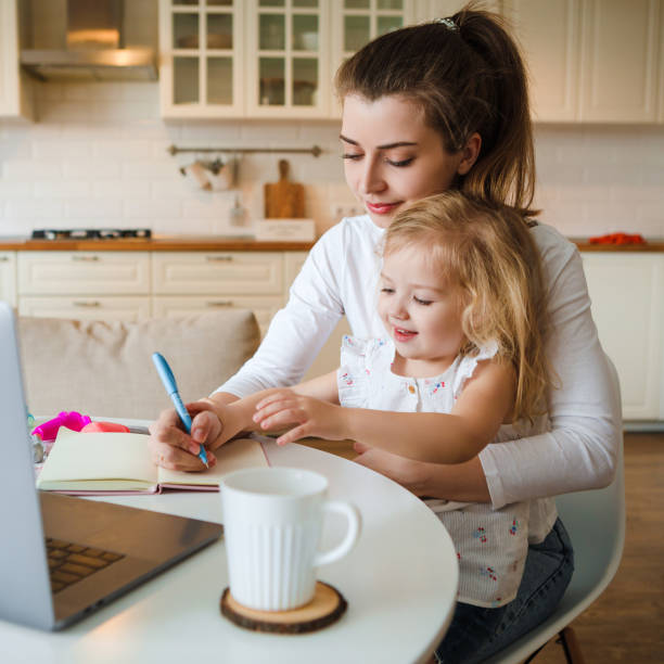 istock Work at home during quarantine. Mom with a child. 1217568000
