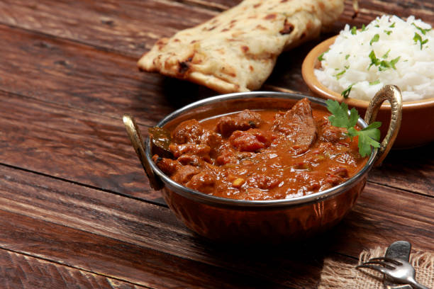 Kashmiri Rogan Josh Indian Cuisine Kashmiri Rogan Josh - Lamb Filet marinated with herbs and spices served with Basmati Rice and Garlic Naan Bread making a delightful tender and spicy meal. jammu and kashmir photos stock pictures, royalty-free photos & images