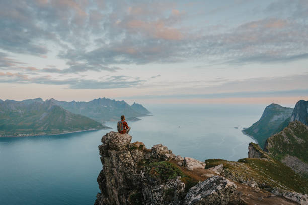 istock Man hiking in mountain on Senja island 1217569823