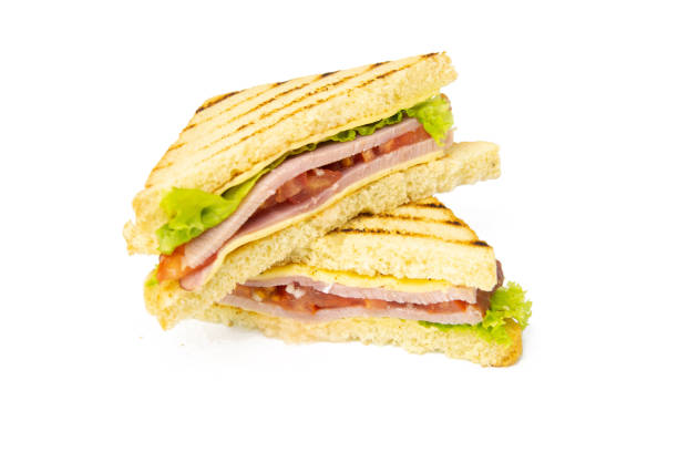 istock Sandwich with ham, cheese, tomatoes, lettuce, and toasted bread. Front view isolated on white background 1217570369