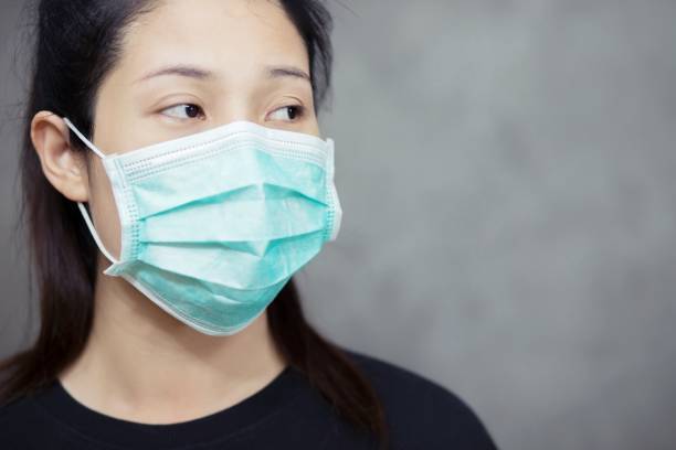 istock Thai Woman Wearing Protective Mask 1217571205