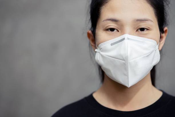 istock Thai Woman Wearing Protective Mask 1217571259