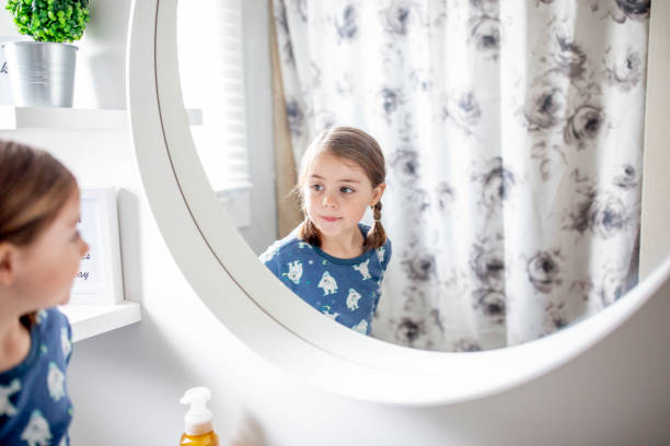 istock Beautiful little girl brushes her teeth. 1217573065