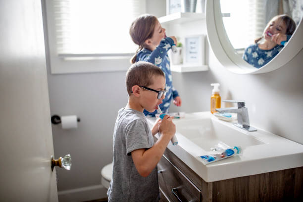 istock Beautiful little girl brushes her teeth. 1217573071