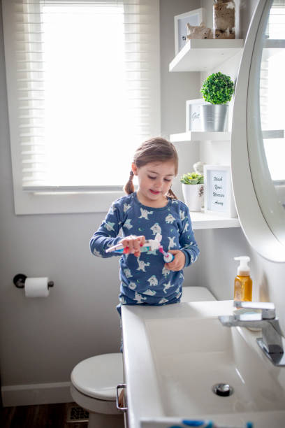 istock Beautiful little girl brushes her teeth. 1217573089