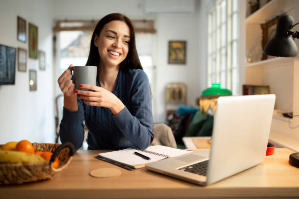 istock Beautiful young woman working from home 1217573535