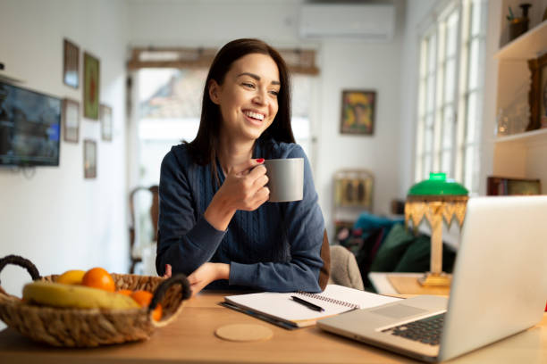 istock Beautiful young woman working from home 1217573697