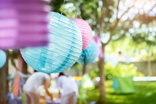 Decorations for outside event, colorful paper balloons, happy children's birthday party in sunny day on backyard, happy life