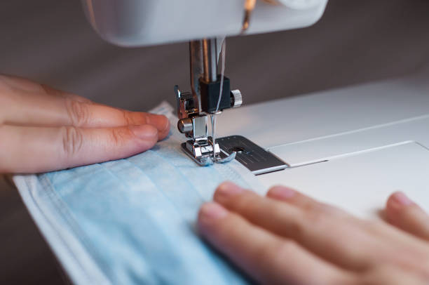 istock Sewing the medical mask on a sewing machine 1217575247