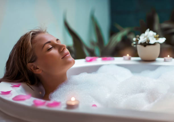 Beautiful girl taking bath at home
