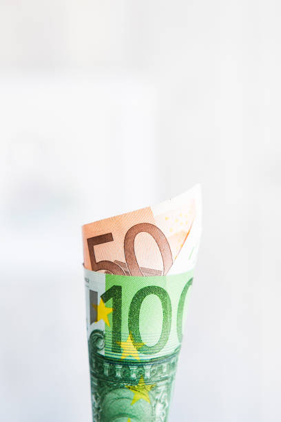 istock Currency notes 50 and 100 euros wrapped as a corner. Money 1217576505