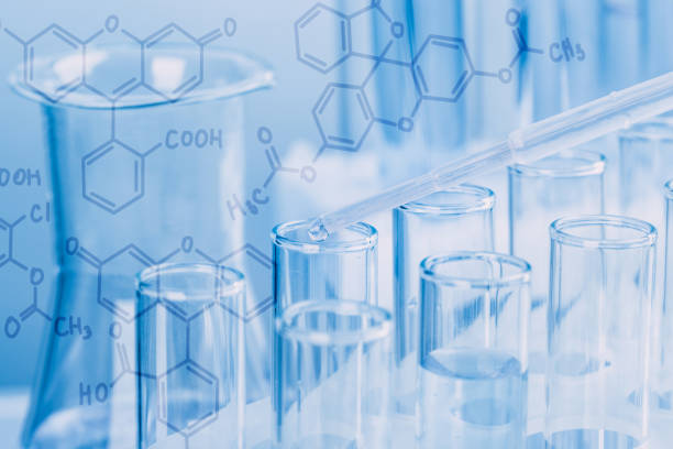 istock Laboratory glassware with a dropper dripping liquid into a test tube. scientific laboratory test tubes, laboratory equipment 1217577665
