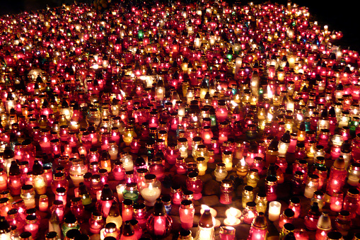 Day of the dead in Poland, a Catholic holiday, candles lit at night in the cemetery a lot