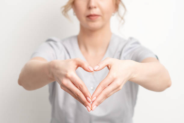 istock Beautician making heart with hand. 1217581378