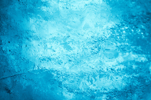Turquoise ice surface of the natural ice cave in Switzerland - textured effect