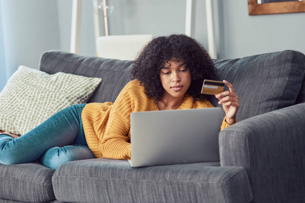 let's get this lazy day going - lying down women laptop freedom imagens e fotografias de stock